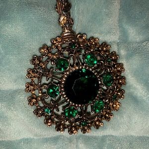 Vintage gold tone filigree with emerald green stones